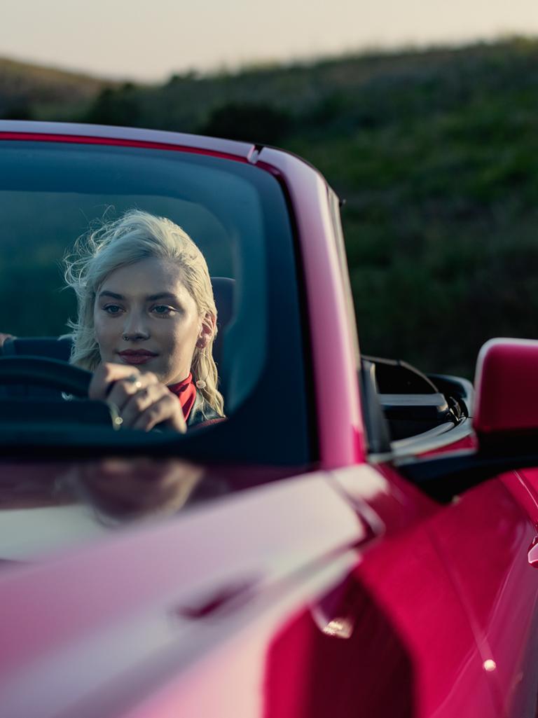 Person driving a 2025 Ford Mustang® GT convertible on a highway