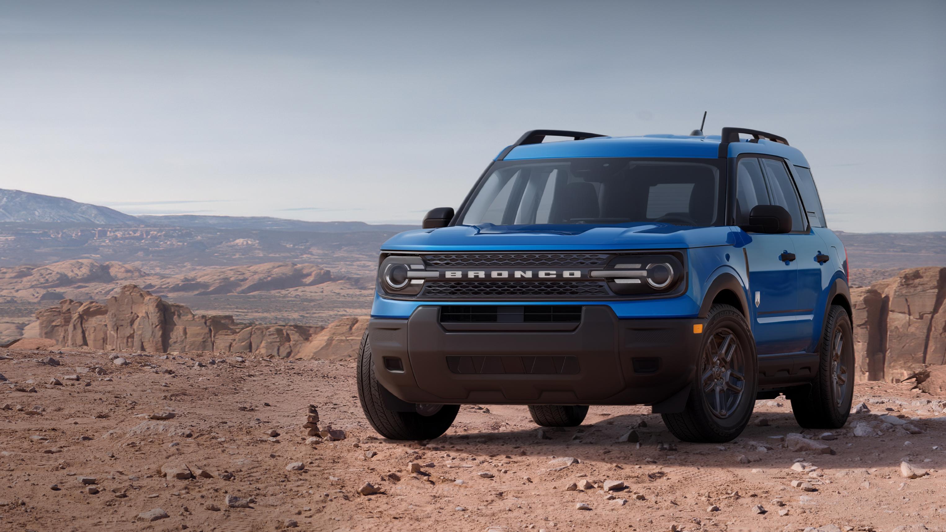 Modèle Ford Bronco Sport® Big Bend® 2026 stationné sur un terrain rocheux avec des formations rocheuses en arrière-plan