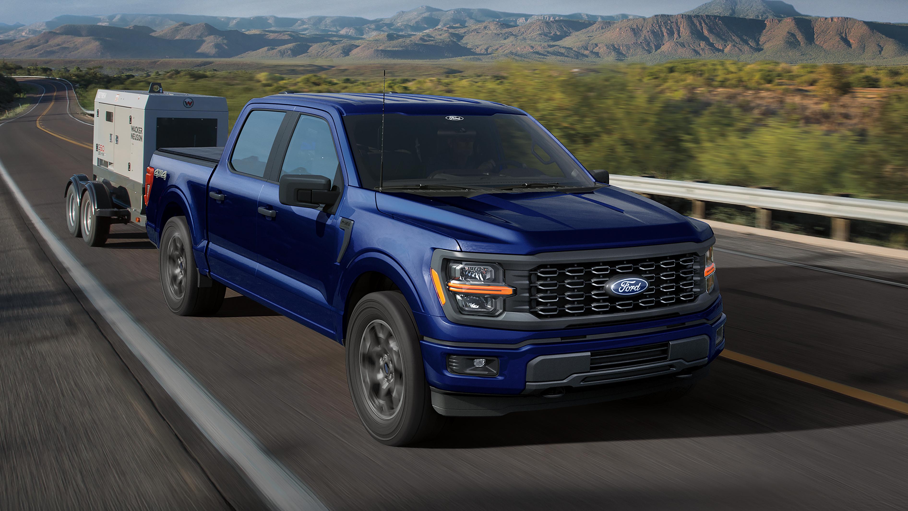 Camionnette Ford F-150® XL 2026 tirant une petite remorque