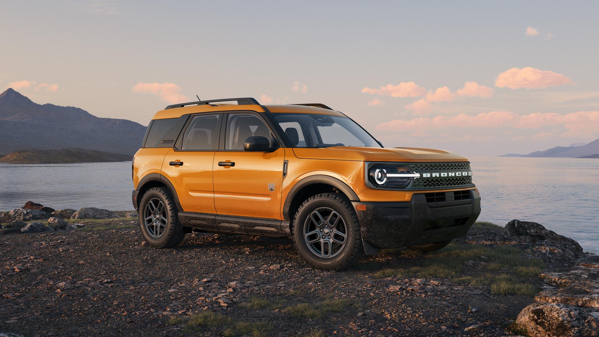 Un Ford Bronco Sport® 2026 stationné sur du gravier à côté d’un lac